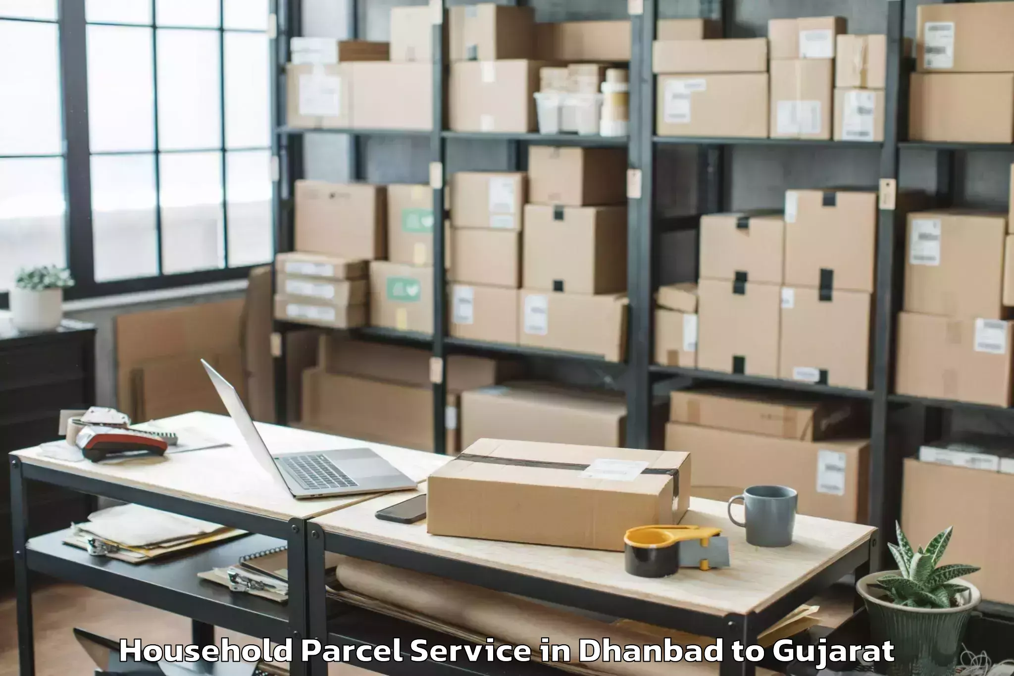 Book Dhanbad to Kadi Household Parcel Online